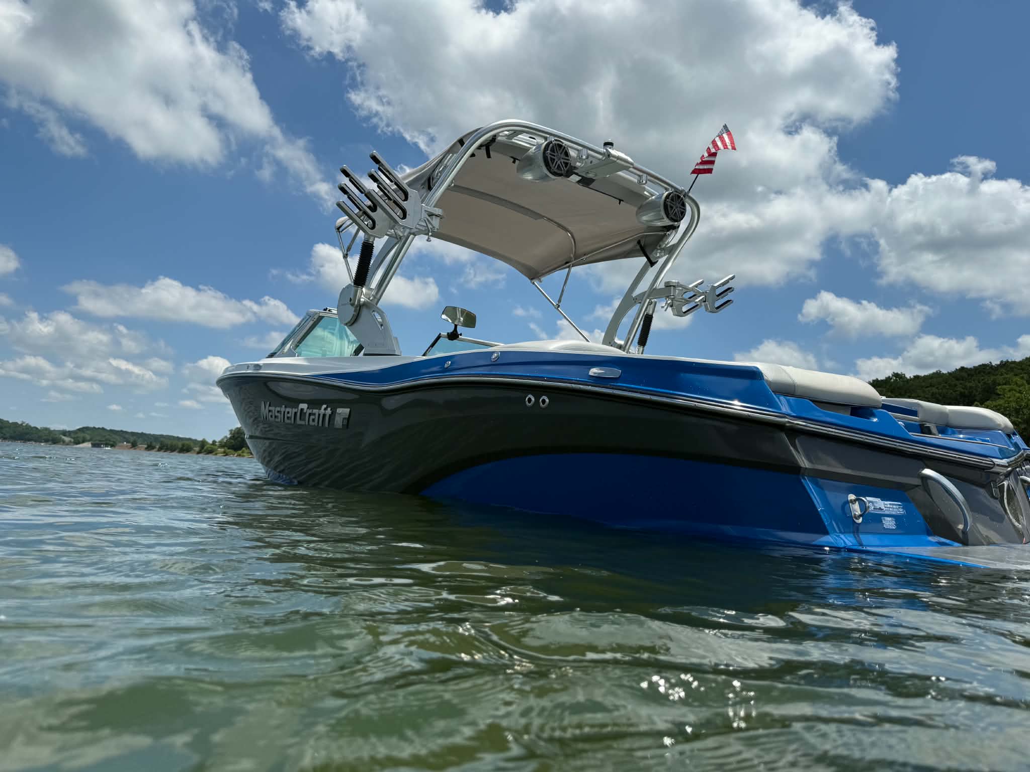 Blue MasterCraft boat on the lake